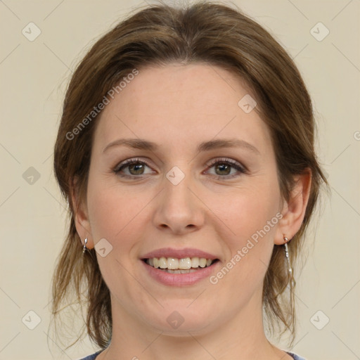 Joyful white young-adult female with medium  brown hair and green eyes