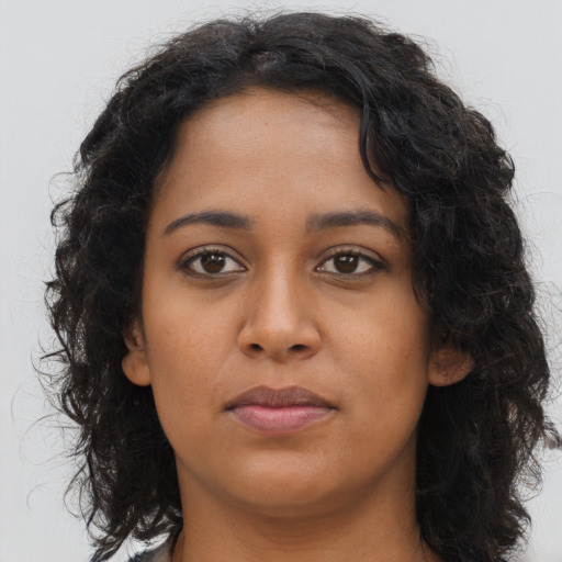 Neutral latino young-adult female with long  brown hair and brown eyes