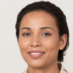 Joyful white young-adult female with medium  brown hair and brown eyes