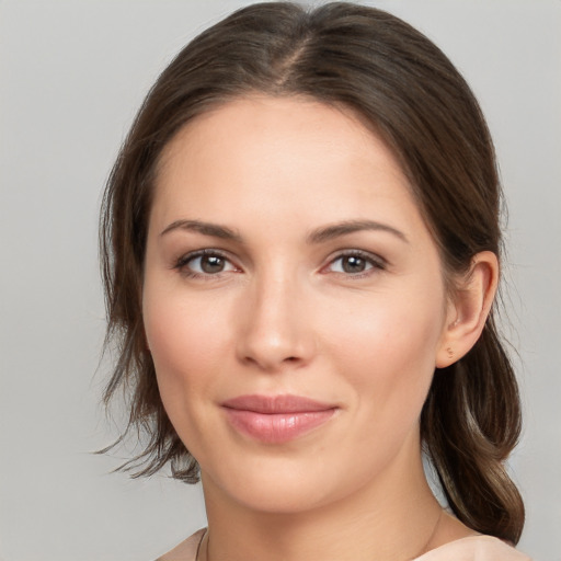 Joyful white young-adult female with medium  brown hair and brown eyes