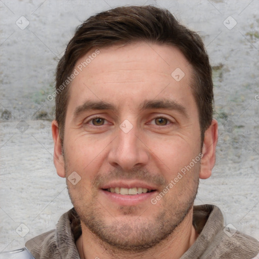 Joyful white adult male with short  brown hair and grey eyes