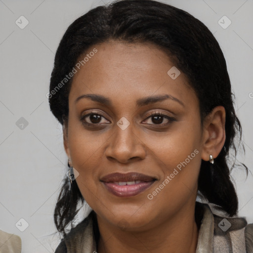 Joyful black young-adult female with long  brown hair and brown eyes