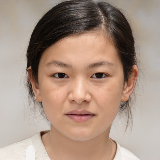 Joyful white child female with medium  brown hair and brown eyes