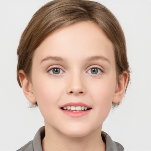 Joyful white child female with medium  brown hair and grey eyes