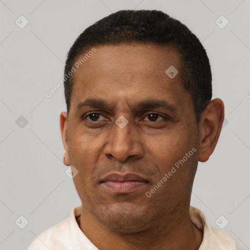 Neutral latino adult male with short  black hair and brown eyes
