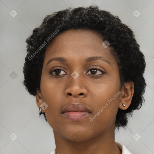 Neutral black young-adult female with short  brown hair and brown eyes