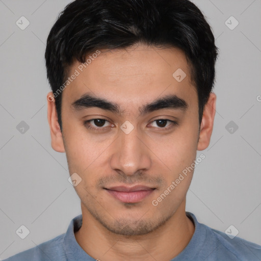 Joyful asian young-adult male with short  black hair and brown eyes