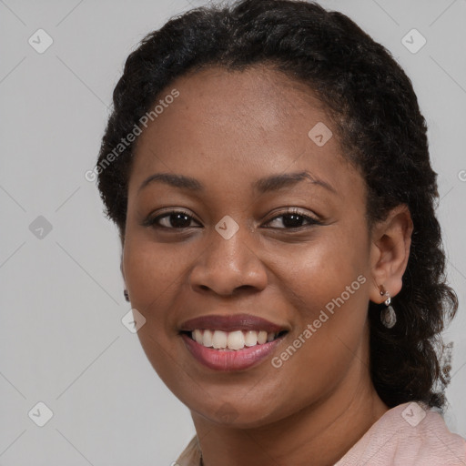 Joyful black young-adult female with medium  black hair and brown eyes