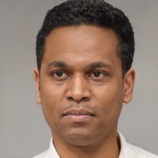 Neutral latino adult male with short  black hair and brown eyes
