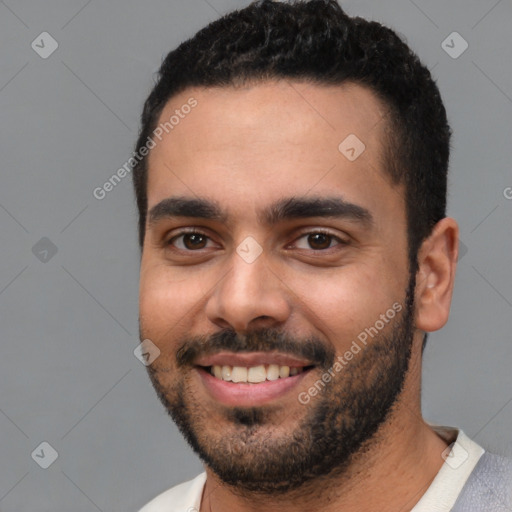 Joyful white young-adult male with short  black hair and brown eyes