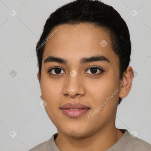 Joyful latino young-adult male with short  black hair and brown eyes