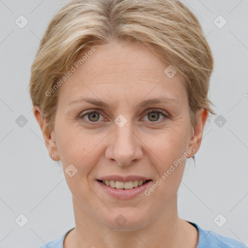 Joyful white adult female with short  brown hair and grey eyes