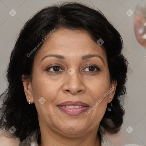 Joyful latino adult female with medium  brown hair and brown eyes