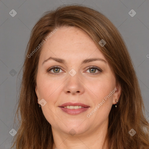 Joyful white adult female with long  brown hair and brown eyes