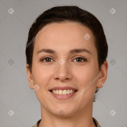 Joyful white young-adult female with short  brown hair and brown eyes