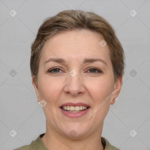 Joyful white adult female with short  brown hair and grey eyes