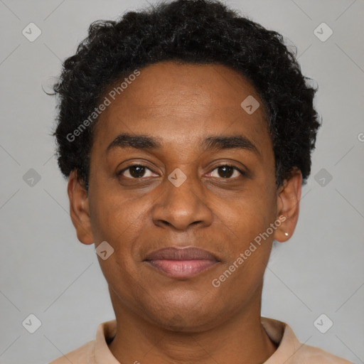 Joyful black adult male with short  brown hair and brown eyes