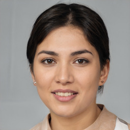 Joyful white young-adult female with medium  brown hair and brown eyes