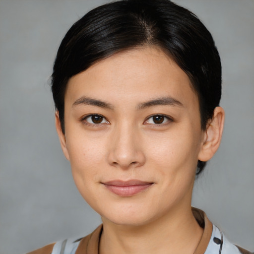Joyful asian young-adult female with medium  brown hair and brown eyes