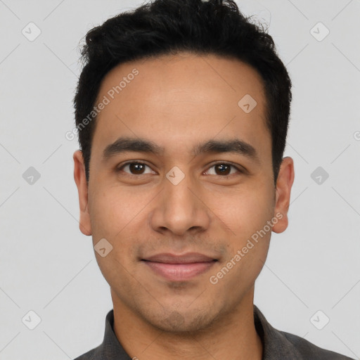 Joyful latino young-adult male with short  black hair and brown eyes