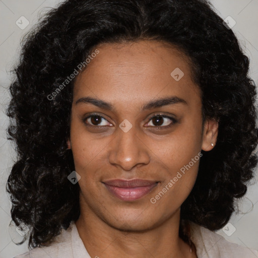 Joyful black young-adult female with medium  brown hair and brown eyes