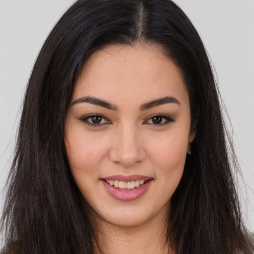 Joyful asian young-adult female with long  brown hair and brown eyes