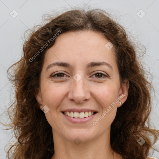 Joyful white adult female with long  brown hair and brown eyes