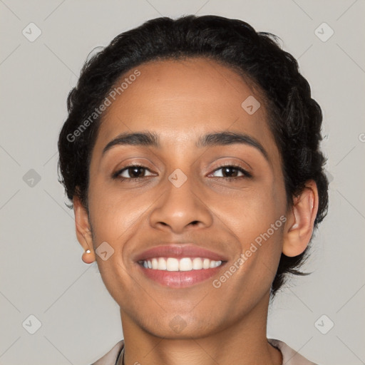 Joyful latino young-adult female with short  brown hair and brown eyes