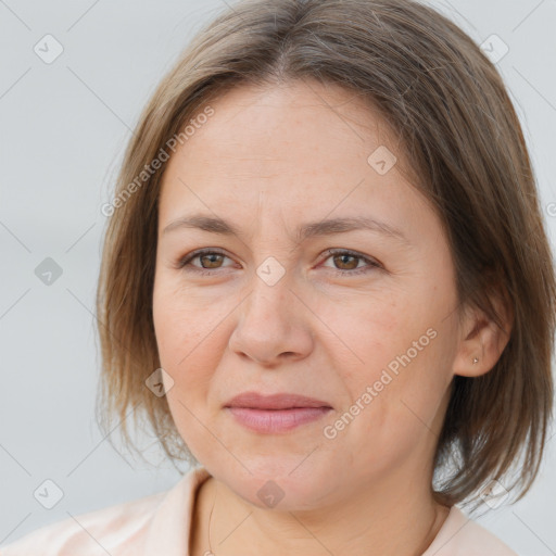 Joyful white adult female with medium  brown hair and brown eyes