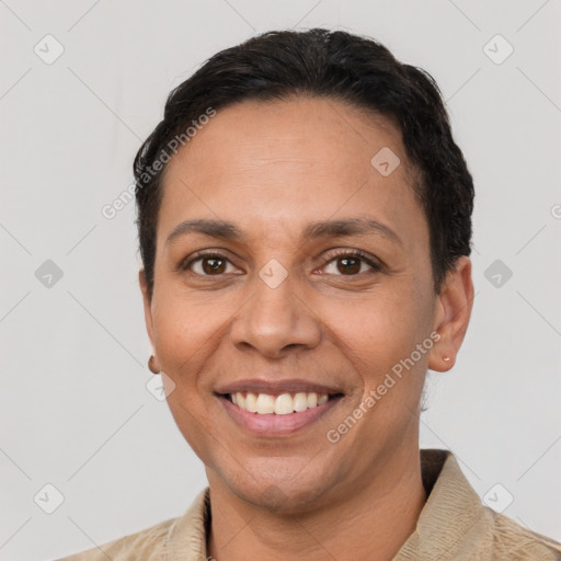 Joyful latino adult female with short  brown hair and brown eyes