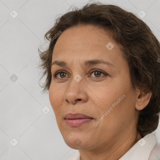 Joyful white adult female with short  brown hair and brown eyes