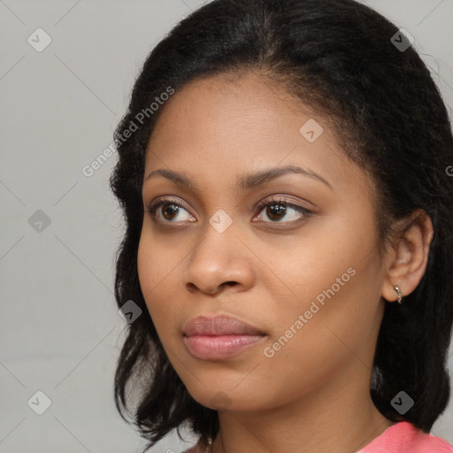 Joyful black young-adult female with medium  brown hair and brown eyes