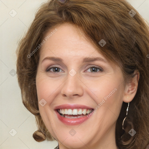 Joyful white young-adult female with long  brown hair and green eyes