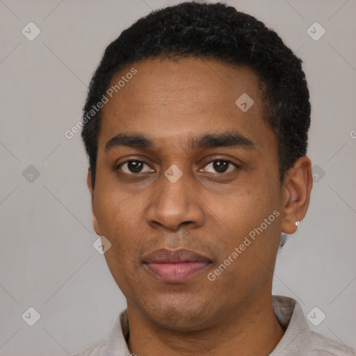 Joyful black young-adult male with short  black hair and brown eyes