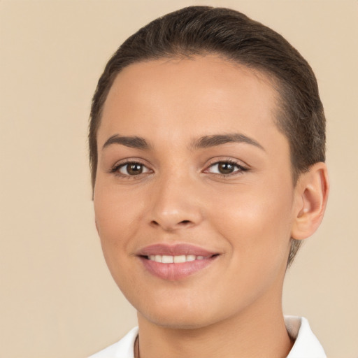 Joyful white young-adult female with short  brown hair and brown eyes