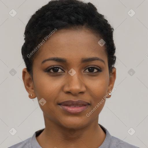 Joyful black young-adult female with short  black hair and brown eyes