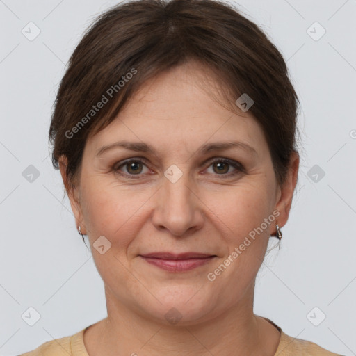 Joyful white adult female with medium  brown hair and brown eyes