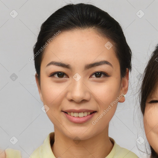 Joyful asian young-adult female with medium  brown hair and brown eyes