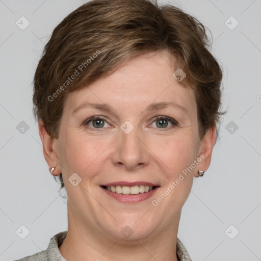 Joyful white adult female with short  brown hair and grey eyes