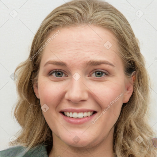 Joyful white young-adult female with long  brown hair and blue eyes