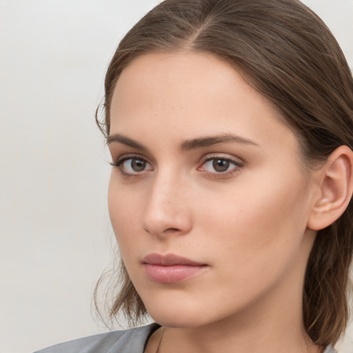 Neutral white young-adult female with medium  brown hair and brown eyes