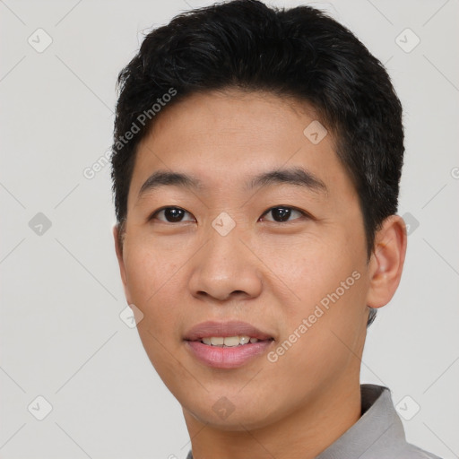 Joyful asian young-adult male with short  brown hair and brown eyes