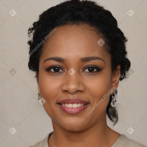 Joyful black young-adult female with long  black hair and brown eyes