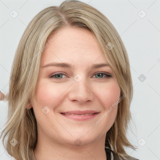 Joyful white young-adult female with long  brown hair and blue eyes