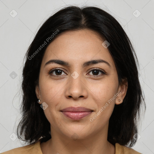 Joyful latino young-adult female with medium  brown hair and brown eyes