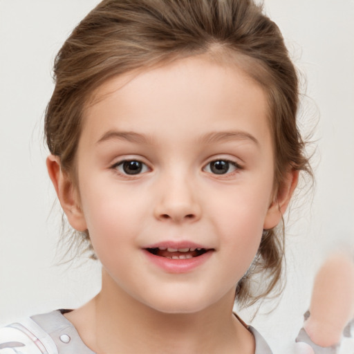 Joyful white child female with medium  brown hair and brown eyes