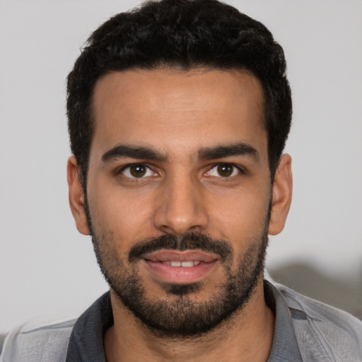 Neutral latino young-adult male with short  black hair and brown eyes
