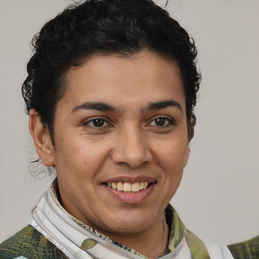 Joyful latino young-adult female with short  brown hair and brown eyes