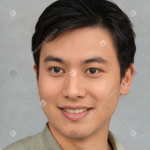 Joyful asian young-adult male with short  brown hair and brown eyes