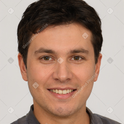 Joyful white young-adult male with short  brown hair and brown eyes